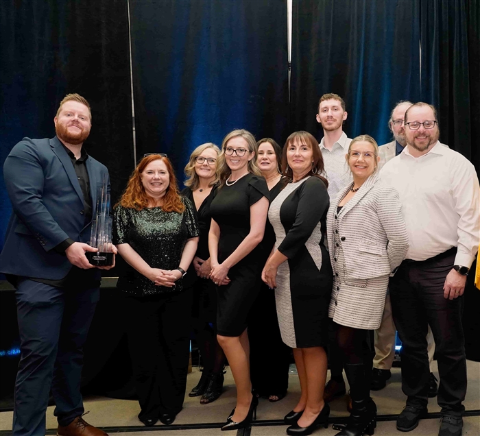 Baker Boyer representatives accepting award