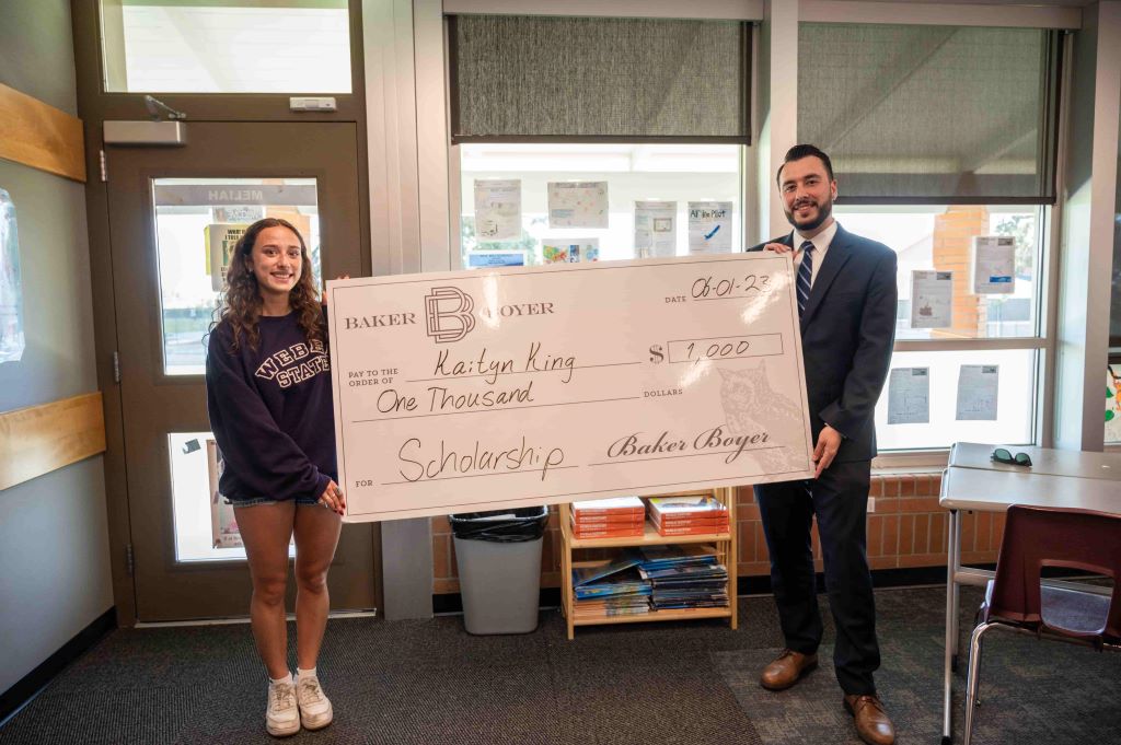 BB Finance Academy awarding scholarship to student