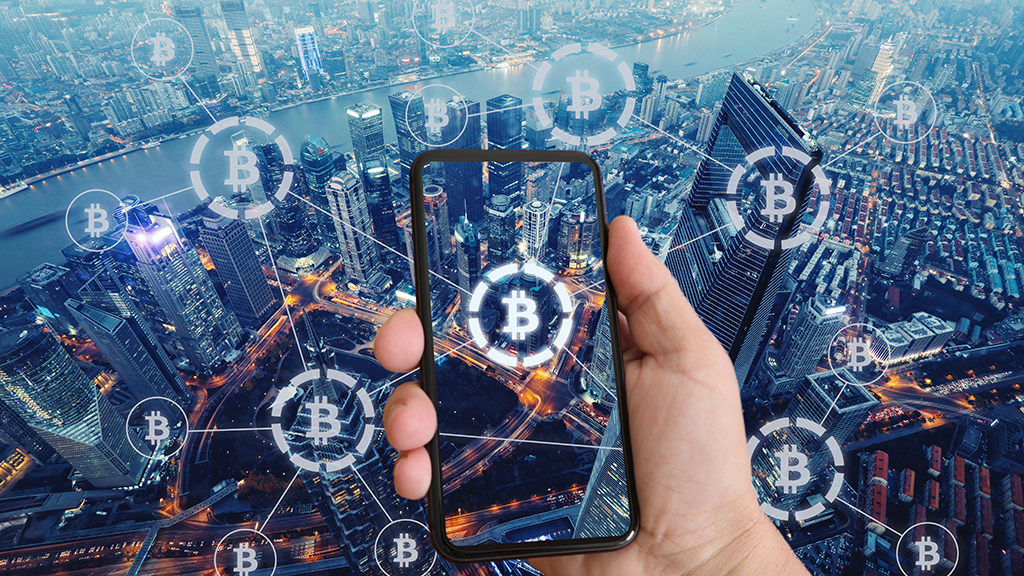 Bitcoin - Hand Holding Cellphone