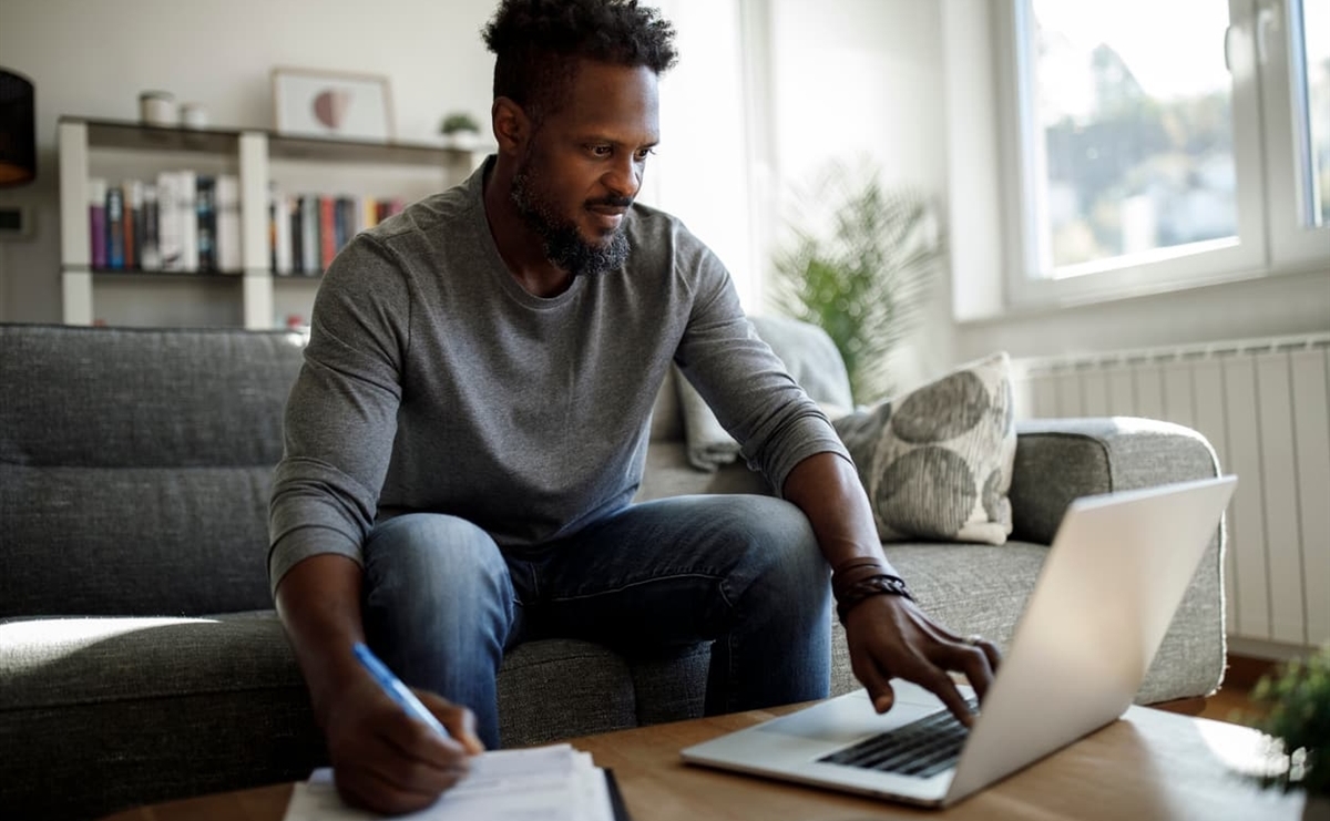 African american business owner updating financial statements