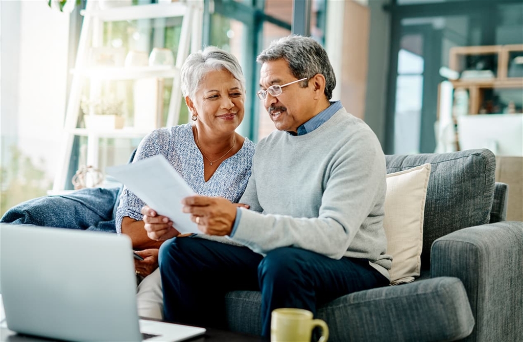 Older couple talking in their living room about philanthropic giving