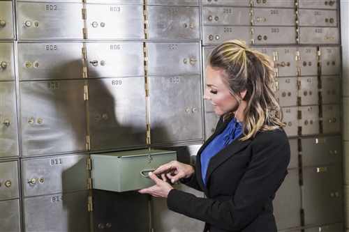 Woman opening Safety Deposit Box