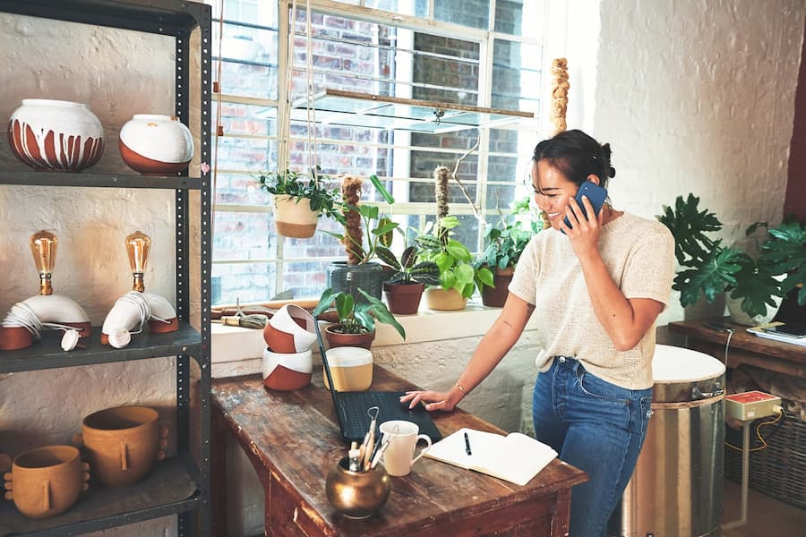 small business owner in pottery studio