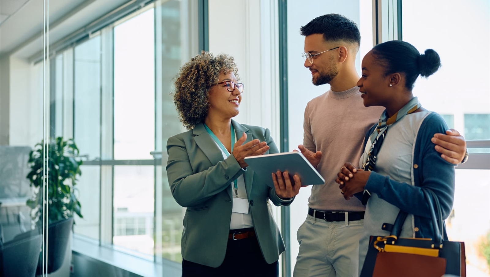 mixed race couple talking with their business lender