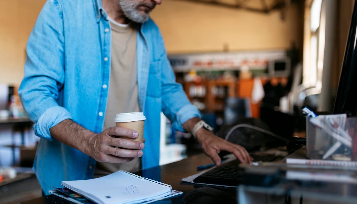 business owner at desk processing online payments