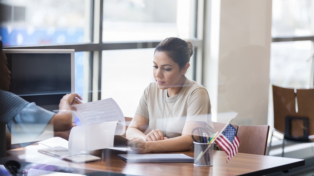female business owner meeting with lender at bank