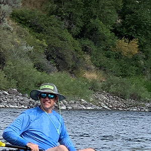 JT on kayak in water