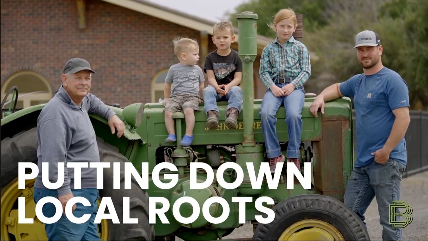 video image "putting down local roots" title card