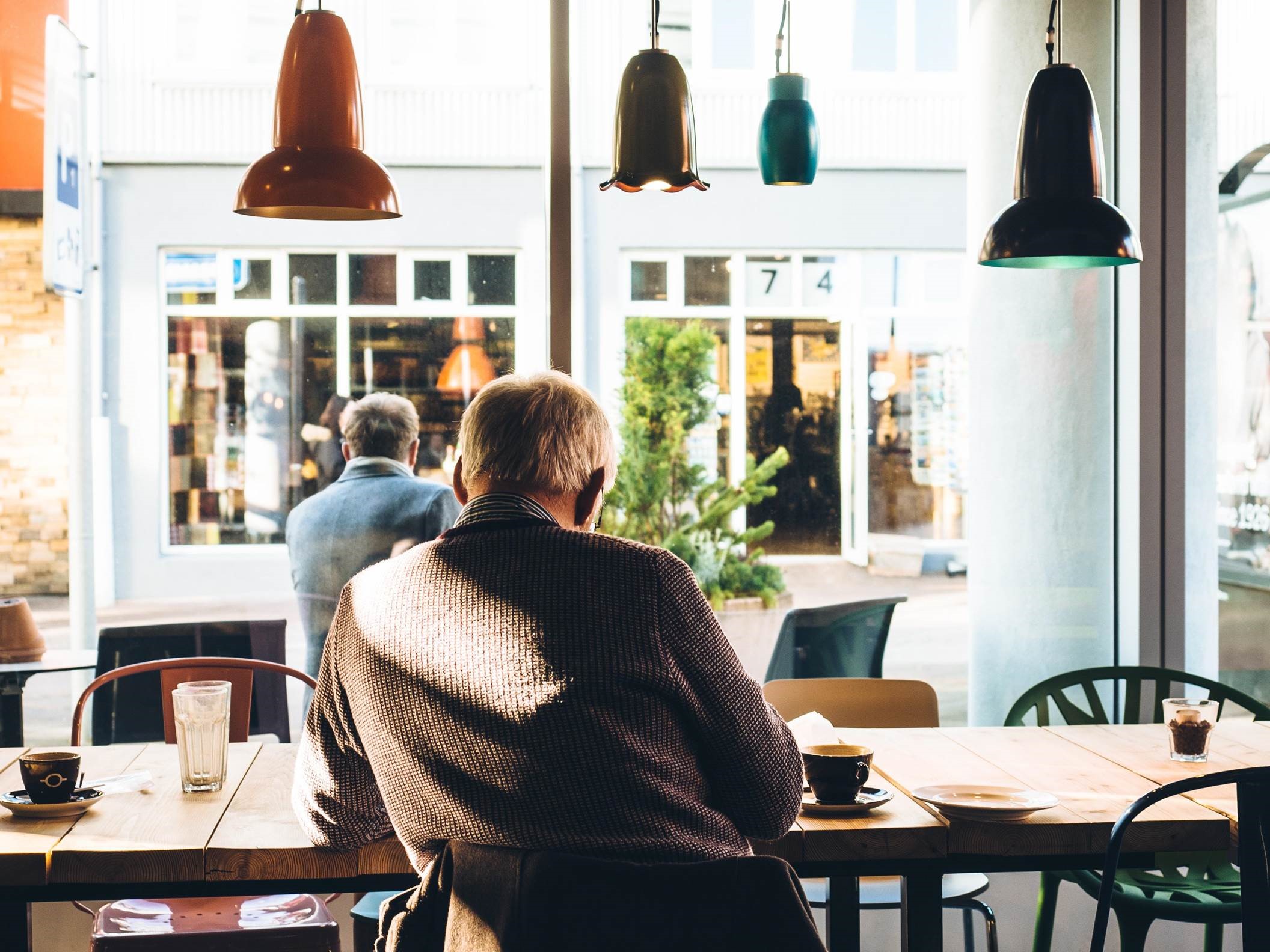 man sitting in coffee shop