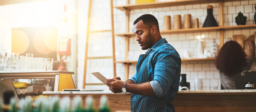 Small business owner at cashier