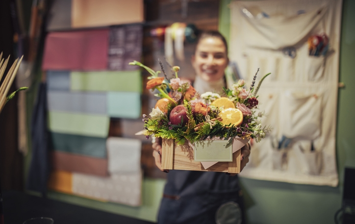 woman giving gift basket