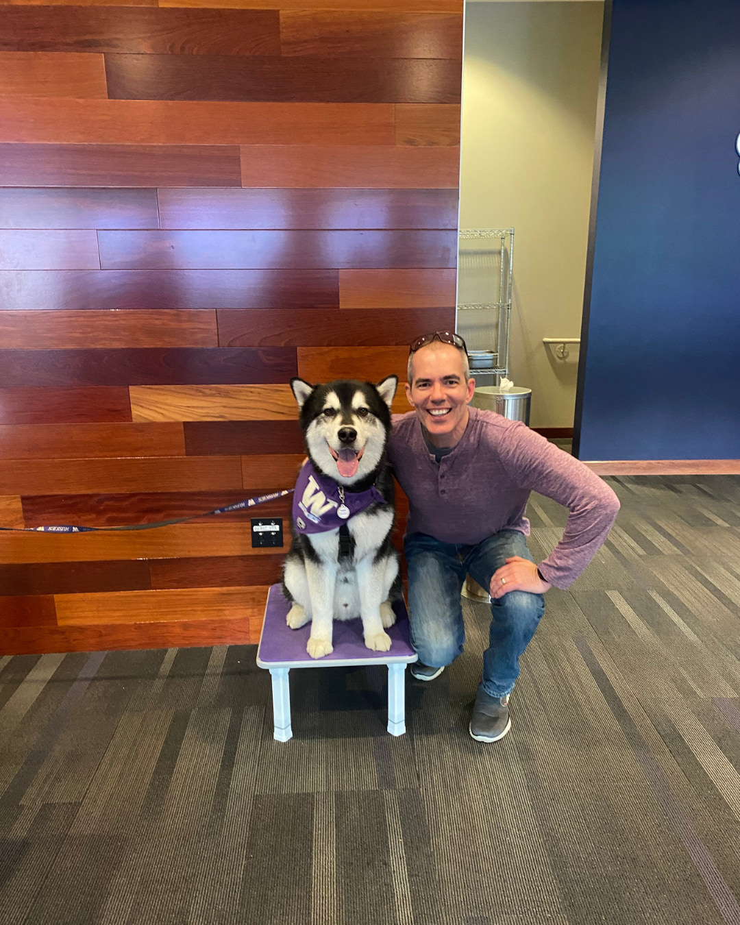 Alan Crain posing with the University of Washington Husky Mascot