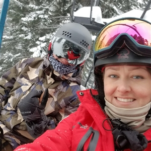 Anna skiing on chairlift 