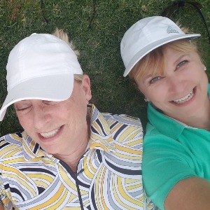 Claudia and friend on golf course