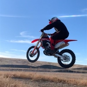 Gary Grant riding a motor bike