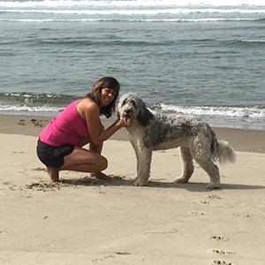 Jolene with her dog on the beach
