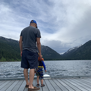 Mario with his son on a dock