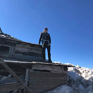 Molly on top of structure in snow