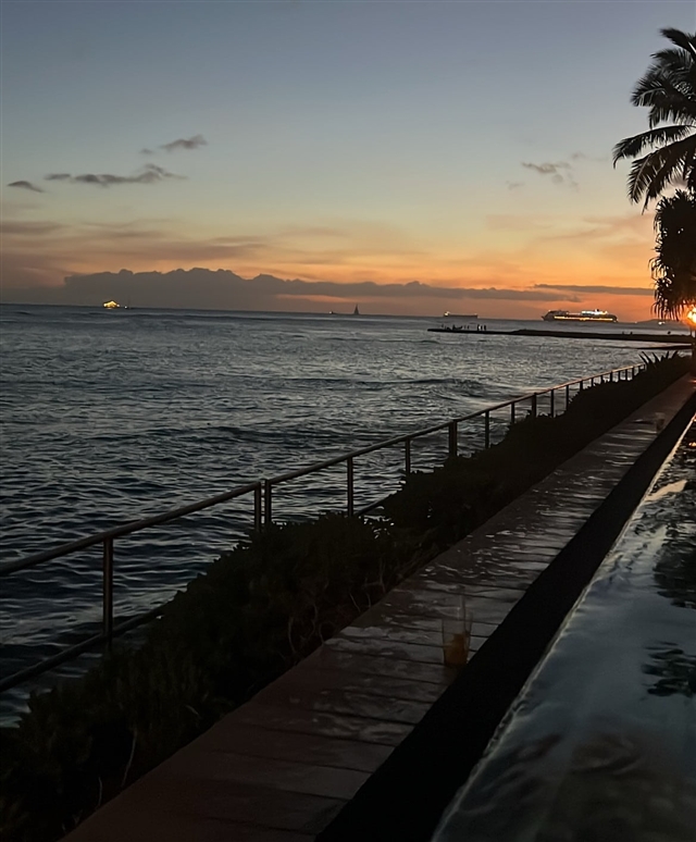 Dock by the sea at sunset