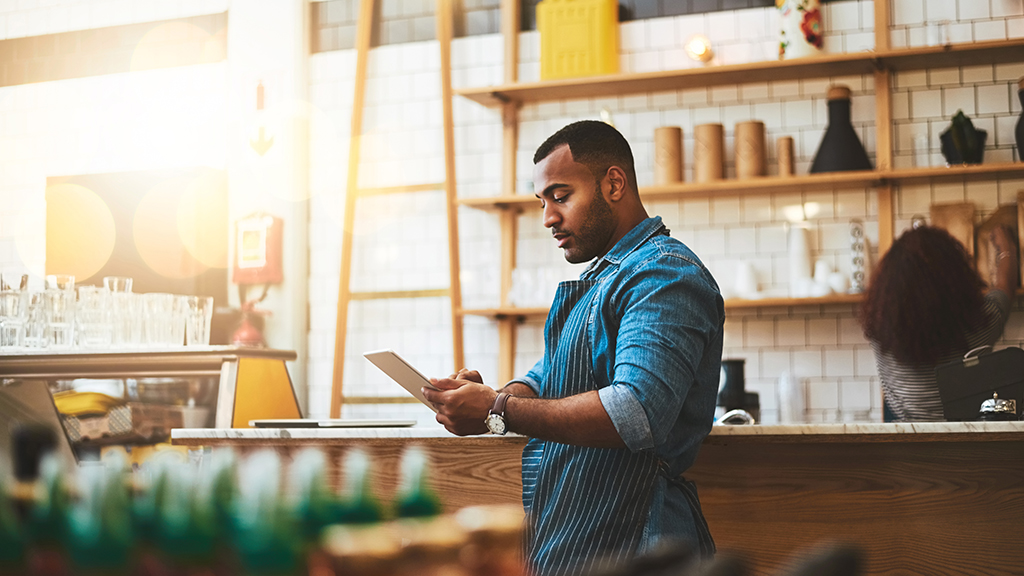 Man holding iPad in business