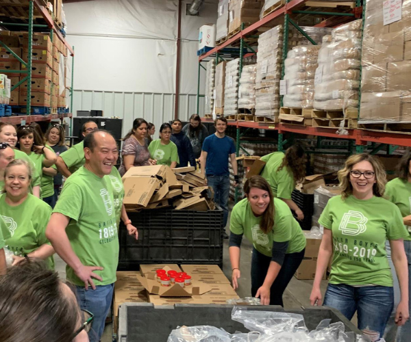Baker Boyer employees volunteering at food bank illustrating being part of the community