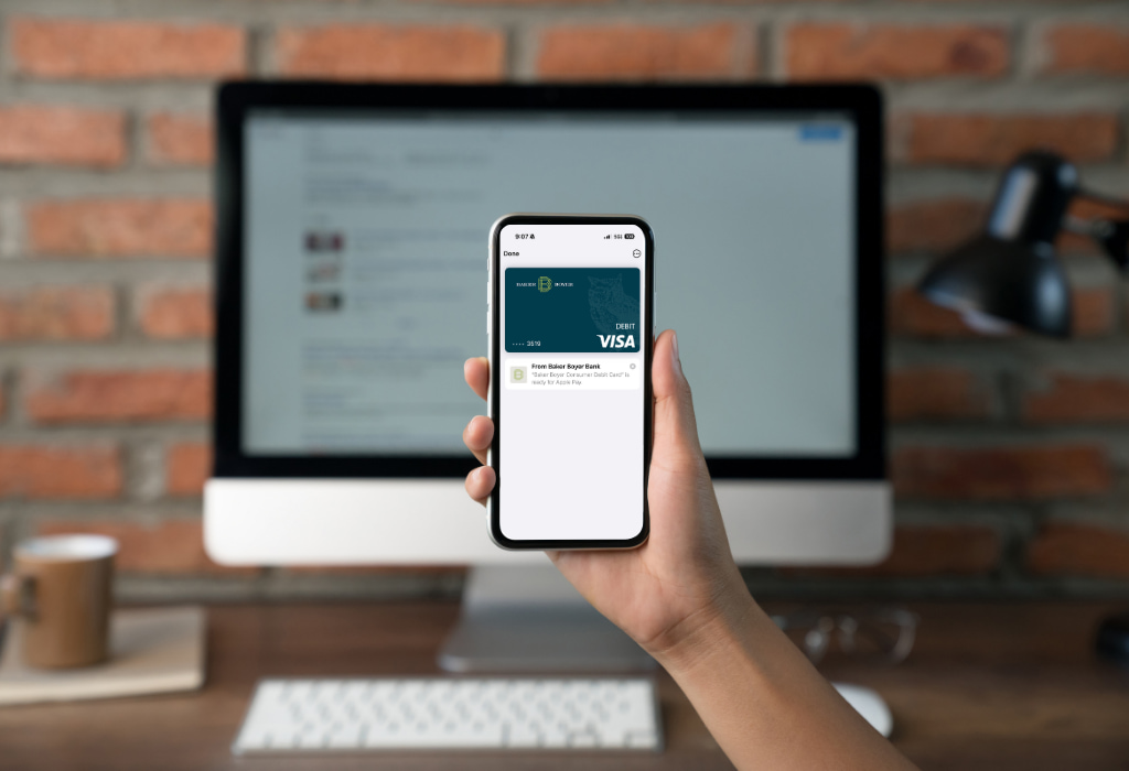 Person using their phone to pay through mobile wallet