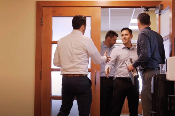 Business advisor shaking hands with clients