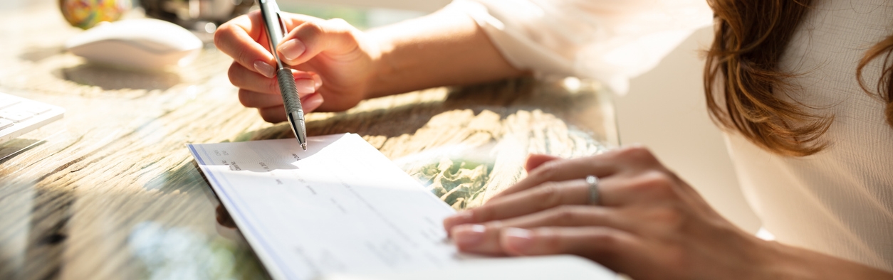 Woman writing a check