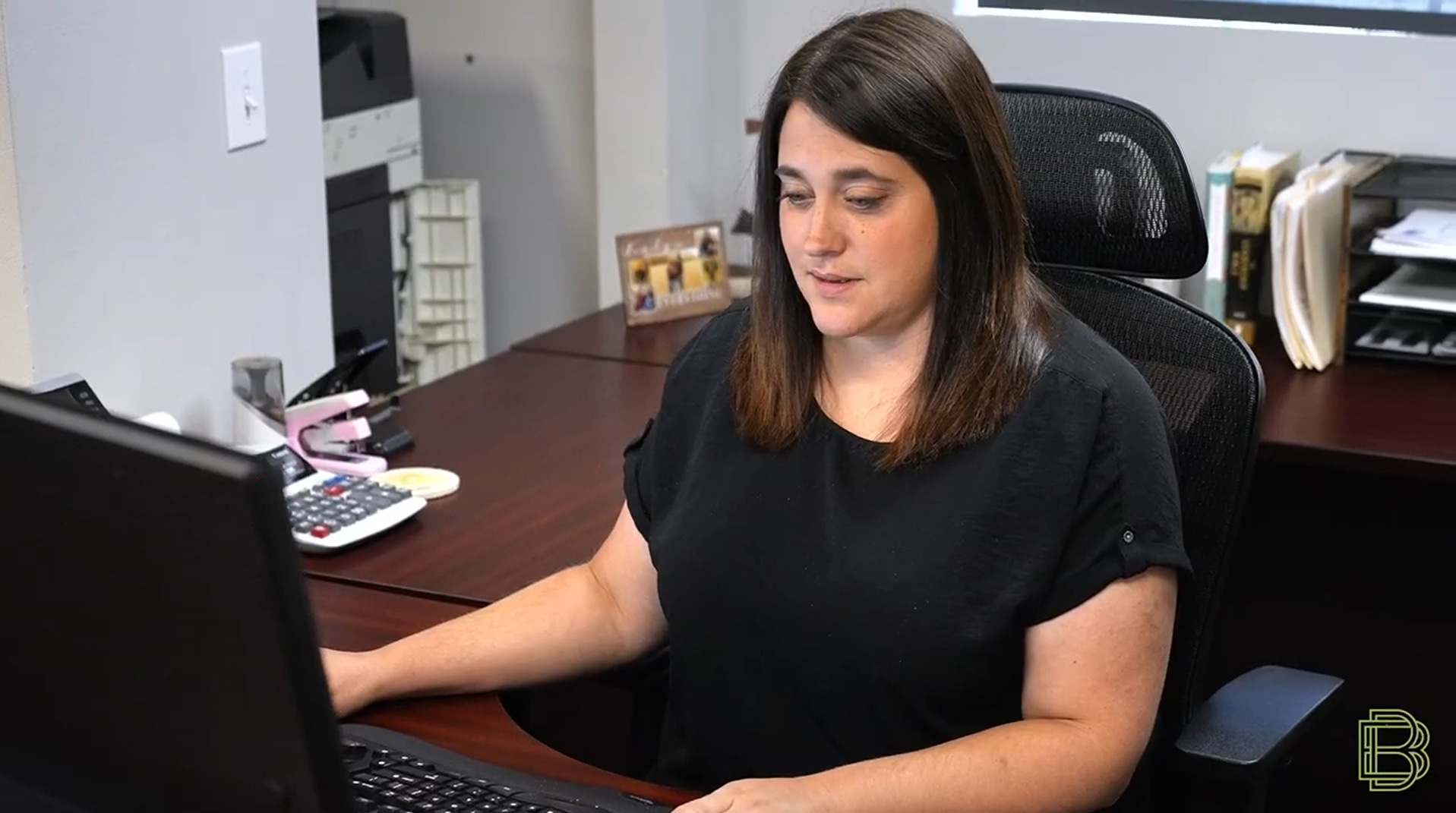 Woman working at her desk on a computer