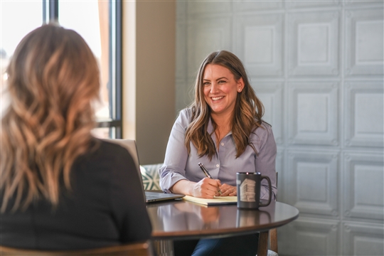 Business Advisor meeting with client smiling